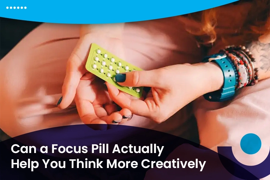 Person holding a focus support pill pack while exploring creative thinking benefits